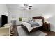 Cozy bedroom with a ceiling fan, natural light, desk, and nightstand at 433 Triumph Ln, Wake Forest, NC 27587