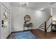 Inviting entryway with a decorative table, rug, and staircase at 433 Triumph Ln, Wake Forest, NC 27587
