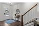 Inviting entryway with staircase, door and decorative rug at 433 Triumph Ln, Wake Forest, NC 27587