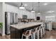 Modern kitchen with granite countertops, stainless steel appliances, and large center island perfect for entertaining at 433 Triumph Ln, Wake Forest, NC 27587