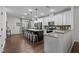 Bright kitchen features granite countertops, stainless steel appliances, and a large center island with seating at 433 Triumph Ln, Wake Forest, NC 27587