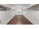 Spacious walk-in closet with wood floor, window, and shelving units at 433 Triumph Ln, Wake Forest, NC 27587