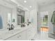 Spacious bathroom with a double vanity, white cabinets, and tile floors at 480 Whitt Ave, Burlington, NC 27215