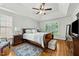 Primary bedroom with a vaulted ceiling, fan, carpet, and great natural light from two windows at 480 Whitt Ave, Burlington, NC 27215