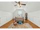 Cozy bedroom with hardwood floors, ceiling fan, and natural light from the window at 480 Whitt Ave, Burlington, NC 27215