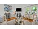 Cozy living room showcasing fireplace, modern décor, and natural light from windows at 480 Whitt Ave, Burlington, NC 27215