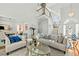 Open-concept living room with natural light, a staircase, modern decor, and hardwood floors at 480 Whitt Ave, Burlington, NC 27215
