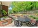 Covered patio area with nice chairs and a beautiful view of the yard at 480 Whitt Ave, Burlington, NC 27215