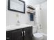 Well-lit bathroom with a vanity, stylish mirror, and shower/tub combo with patterned curtain at 4822 Blue Bird Ct # B, Raleigh, NC 27606