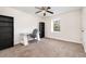 Bright bedroom with a desk, chair, built in bookshelves and a window bringing in natural light at 4822 Blue Bird Ct # B, Raleigh, NC 27606
