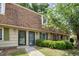 Townhouse complex with sidewalks and shrubbery at 4822 Blue Bird Ct # B, Raleigh, NC 27606