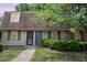 Charming townhouse exterior with well-maintained landscaping, green shutters, and inviting entryway at 4822 Blue Bird Ct # B, Raleigh, NC 27606