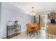 Kitchen nook with a table set and access to the fenced in backyard at 4822 Blue Bird Ct # B, Raleigh, NC 27606