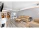 Comfortable living room with sofas and open access to the kitchen at 4822 Blue Bird Ct # B, Raleigh, NC 27606