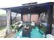 Outdoor gazebo featuring comfortable seating and mosquito curtains, perfect for entertaining at 49 Pumpkin Hill Rdg, Clayton, NC 27520