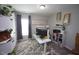 Bright home office with a modern desk, stylish decor, and plenty of natural light at 49 Pumpkin Hill Rdg, Clayton, NC 27520