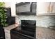 Well-equipped kitchen features stainless steel appliances, granite countertops, and modern finishes perfect for cooking at 49 Pumpkin Hill Rdg, Clayton, NC 27520
