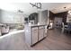 Kitchen island with barstool seating, granite countertops, and decorative cabinets offering ample space for cooking at 49 Pumpkin Hill Rdg, Clayton, NC 27520
