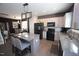 Open-concept kitchen boasts an island with seating, stainless appliances, and stylish finishes for cooking and gathering at 49 Pumpkin Hill Rdg, Clayton, NC 27520