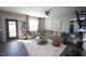 Spacious living room featuring an L-shaped sofa, area rug, and neutral colors for a comfortable living area at 49 Pumpkin Hill Rdg, Clayton, NC 27520