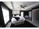 Spacious main bedroom with tray ceilings, large windows, and a modern black and white design at 49 Pumpkin Hill Rdg, Clayton, NC 27520