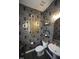 Stylish powder room featuring bold wallpaper, artistic mirror, and modern fixtures for a unique design at 49 Pumpkin Hill Rdg, Clayton, NC 27520