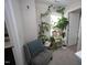 Cozy sitting area with plants, a decorative pillow, and access to the adjacent bathroom at 49 Pumpkin Hill Rdg, Clayton, NC 27520