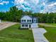 Beautiful two-story home with a well-manicured lawn and long driveway at 499 Beacon Hill Rd # 30, Lillington, NC 27546