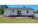 Well-maintained backyard has a patio, and mature trees at 500 Lemontree Ct, Graham, NC 27253