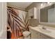 Cozy bathroom featuring a decorative shower curtain, neutral decor, and vanity at 500 Lemontree Ct, Graham, NC 27253
