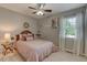 Inviting bedroom with wood-look floors, stylish decor, and a ceiling fan at 500 Lemontree Ct, Graham, NC 27253