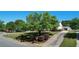 Landscaped lawn with mature trees and a long driveway leading to a charming home at 500 Lemontree Ct, Graham, NC 27253