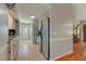Open kitchen features white cabinets, stainless steel appliances, and flows into a dining area at 500 Lemontree Ct, Graham, NC 27253