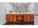 Elegant bathroom with double sinks, vanity, and marble floors at 500 Old Greensboro Rd, Chapel Hill, NC 27516