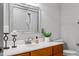 Bathroom featuring a modern mirror, an updated vanity, and toilet with sleek fixtures at 500 Old Greensboro Rd, Chapel Hill, NC 27516