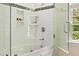 Modern bathroom with tiled shower, soaking tub and glass door at 500 Old Greensboro Rd, Chapel Hill, NC 27516