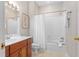 Cozy bathroom with a single sink vanity, ceramic tile, and a shower-tub combination at 500 Old Greensboro Rd, Chapel Hill, NC 27516