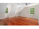 Sun-filled bedroom with multiple windows and hardwood floors at 500 Old Greensboro Rd, Chapel Hill, NC 27516