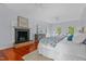 Primary bedroom with brick fireplace, ceiling fans, and beautiful natural light at 500 Old Greensboro Rd, Chapel Hill, NC 27516