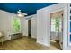 Bright bedroom with blue ceiling, natural light, a ceiling fan, and a sliding barn door for closet access at 500 Old Greensboro Rd, Chapel Hill, NC 27516