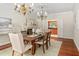 Formal dining room with elegant chandelier, fireplace, and sophisticated decor at 500 Old Greensboro Rd, Chapel Hill, NC 27516