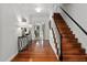 Welcoming foyer with hardwood floors, elegant staircase, and sophisticated decor at 500 Old Greensboro Rd, Chapel Hill, NC 27516