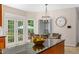 Bright eat-in kitchen featuring black counters, tile floors, and a large window with views of the outdoors at 500 Old Greensboro Rd, Chapel Hill, NC 27516