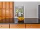 Gourmet kitchen featuring granite countertops and seamless flow into adjacent dining room at 500 Old Greensboro Rd, Chapel Hill, NC 27516