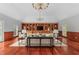 Large formal living room with coffered ceiling, hardwood floors, built-in shelves and a fireplace at 500 Old Greensboro Rd, Chapel Hill, NC 27516