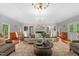 Cozy formal living room with hardwood floors, brick fireplace, and elegant decor at 500 Old Greensboro Rd, Chapel Hill, NC 27516