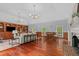 Spacious living room featuring hardwood floors, coffered ceilings, and large built-in shelving at 500 Old Greensboro Rd, Chapel Hill, NC 27516