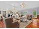 Formal living room with hardwood floors, fireplace, and a neutral color scheme at 500 Old Greensboro Rd, Chapel Hill, NC 27516