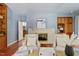 Comfortable living room with white brick fireplace and built-in bookcases at 500 Old Greensboro Rd, Chapel Hill, NC 27516