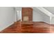 Inviting living room features a brick fireplace and hardwood floors at 500 Old Greensboro Rd, Chapel Hill, NC 27516
